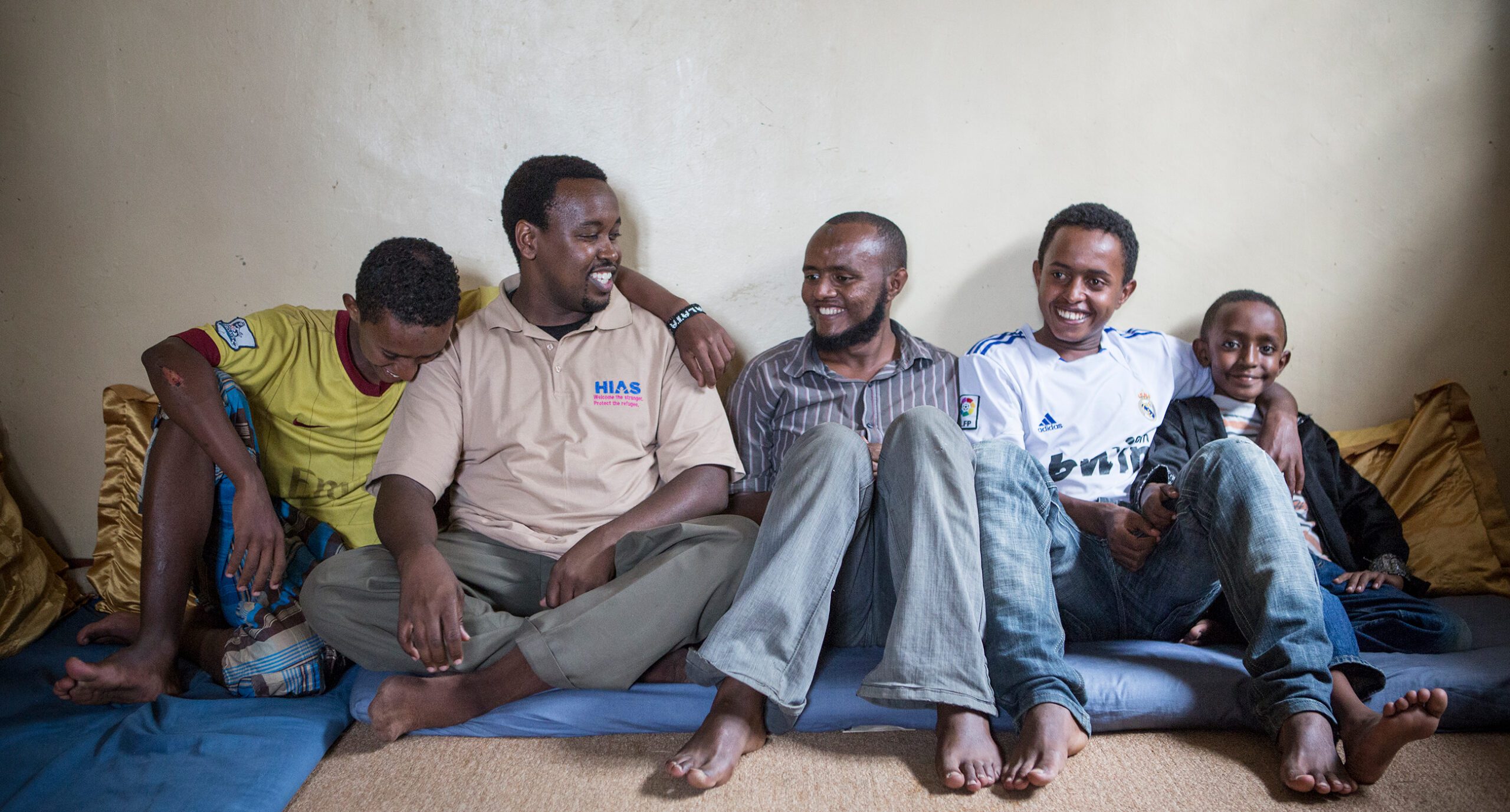 A HIAS local staff member meets with an Ethiopian family seeking asylum. He helps make sure that the needs of the family are met as they wait.  (Glenna Gordon for HIAS)