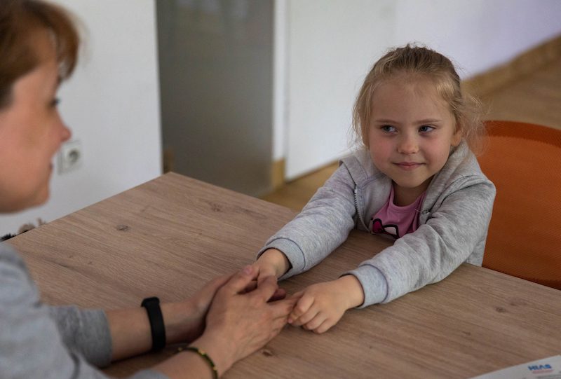 Oksana Bezkorovaina and her daughter Mariia wait in The Ukrainian House in Warsaw before shifting to an Airbnb where they are staying with help from Our Choice and HIAS on June 4, 2022 in Warsaw, Poland.