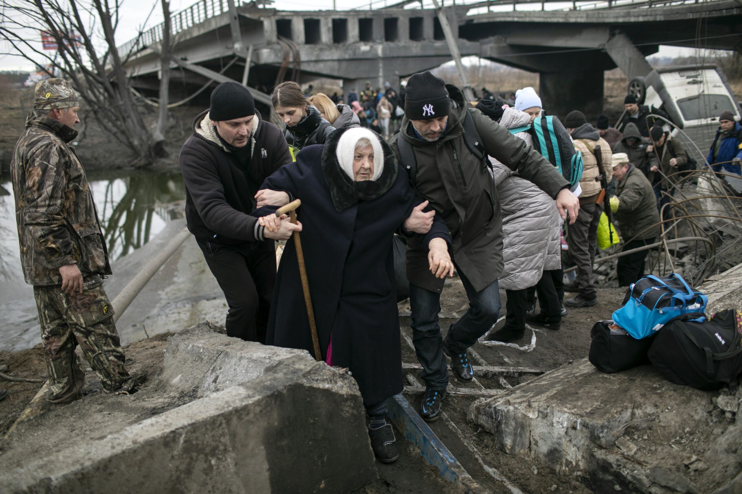 Civilians cross a destroyed bridge as they flee the city of Irpin, Kiev, Ukraine, during heavy bombardment by the Russian Army, March 5, 2022. (Photo Credit: AG)

Image may be used in any HIAS materials, print and digital, until March 8, 2023. After this date, additional usage must be re-negotiated directly with photographer. No affiliate rights granted.