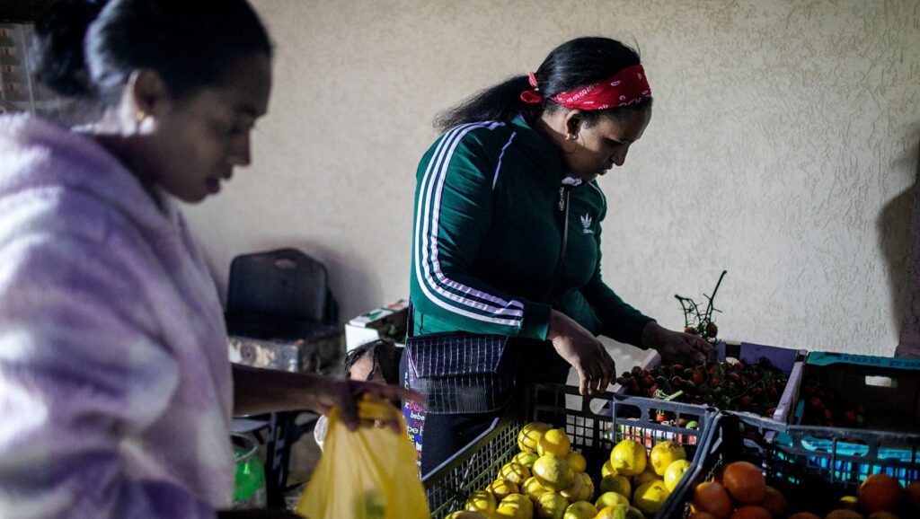 African refugees appear at a food distribution center in Israel.