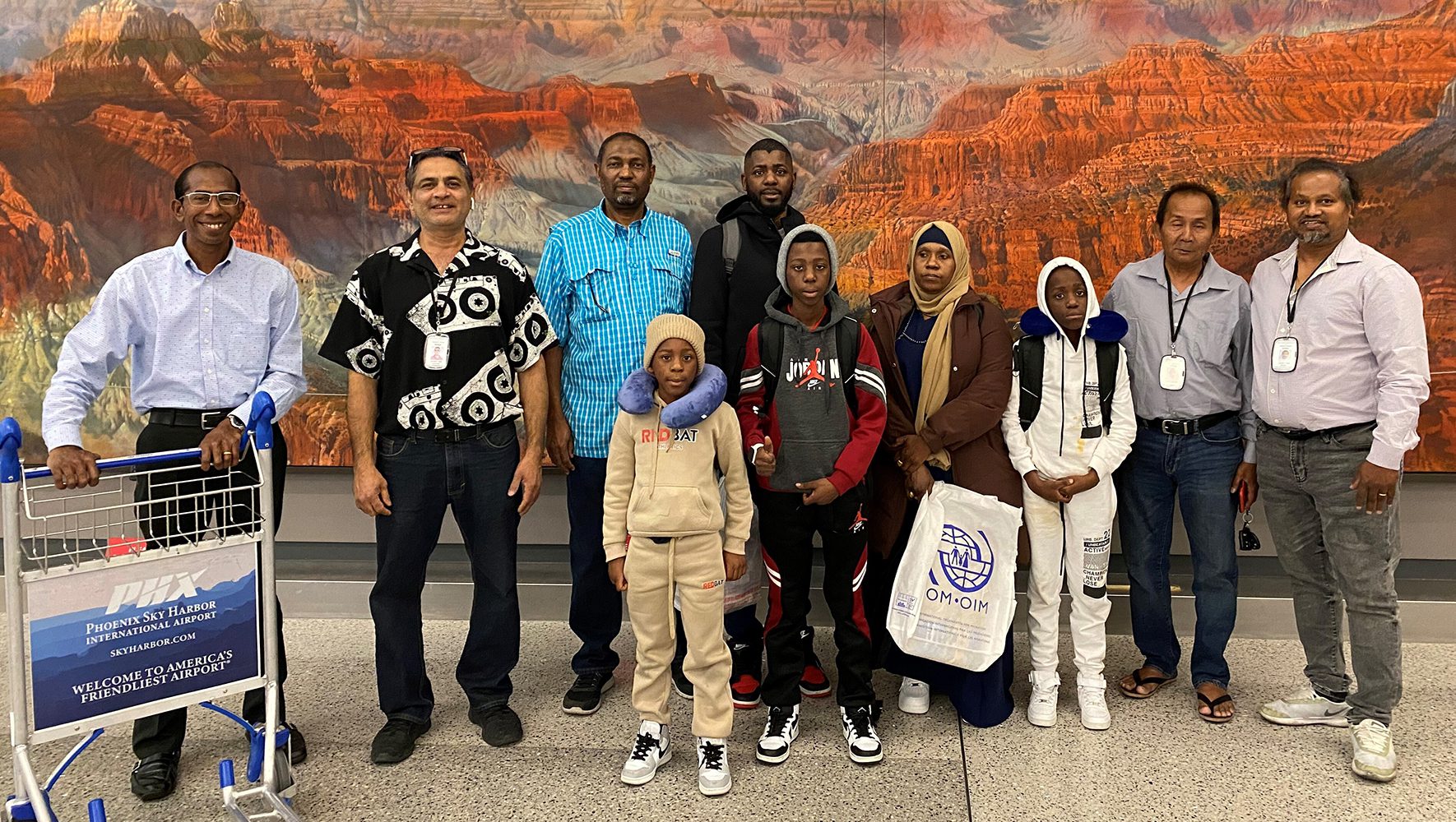 The Resettlement Organization of Migrants of Arizona (ROMA) greets HIAS’ first Welcome Corps family at Phoenix Sky Harbor International Airport on July 6, 2023. | Welcome Corps