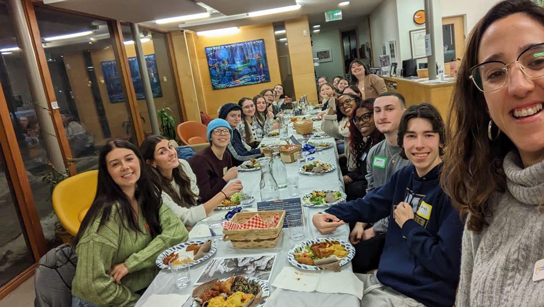 Students gather to hear from Mari Beza, JAFI Israel fellow at Penn Hillel, in honor of Refugee Shabbat at Hillel Milwaukee on February 3, 2023. (Hillel Milwaukee)