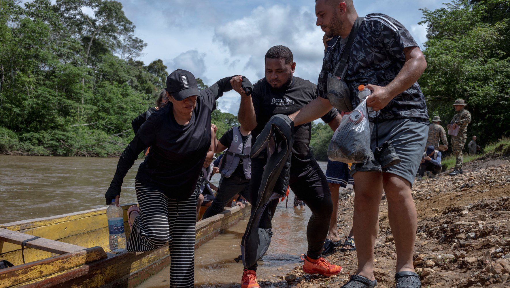 Boats carrying displaced people arrive from Bajo Chiquito, an indigenous village located at the exit of the migration route crossing the Darien Gap on October 21, 2024 in Lajas Blancas, Panama. (Nadege Mazars for HIAS)