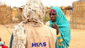 A HIAS worker meets with a displaced Sudanese resident of a refugee camp in Aboutengue, Chad (HIAS Chad)