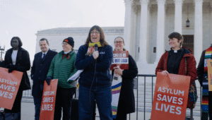 HIAS' VP for U.S. Policy and Advocacy Naomi Steinberg speaks at a rally during the Supreme Court hearing of Mullin v. Al Otro Lado, in which HIAS has filed an amicus brief on March 24, 2026 in Washington, D.C. The Supreme Court will decide whether people fleeing violence and persecution can still seek asylum at the U.S.-Mexico border. (Lindsay Kagalis/HIAS)