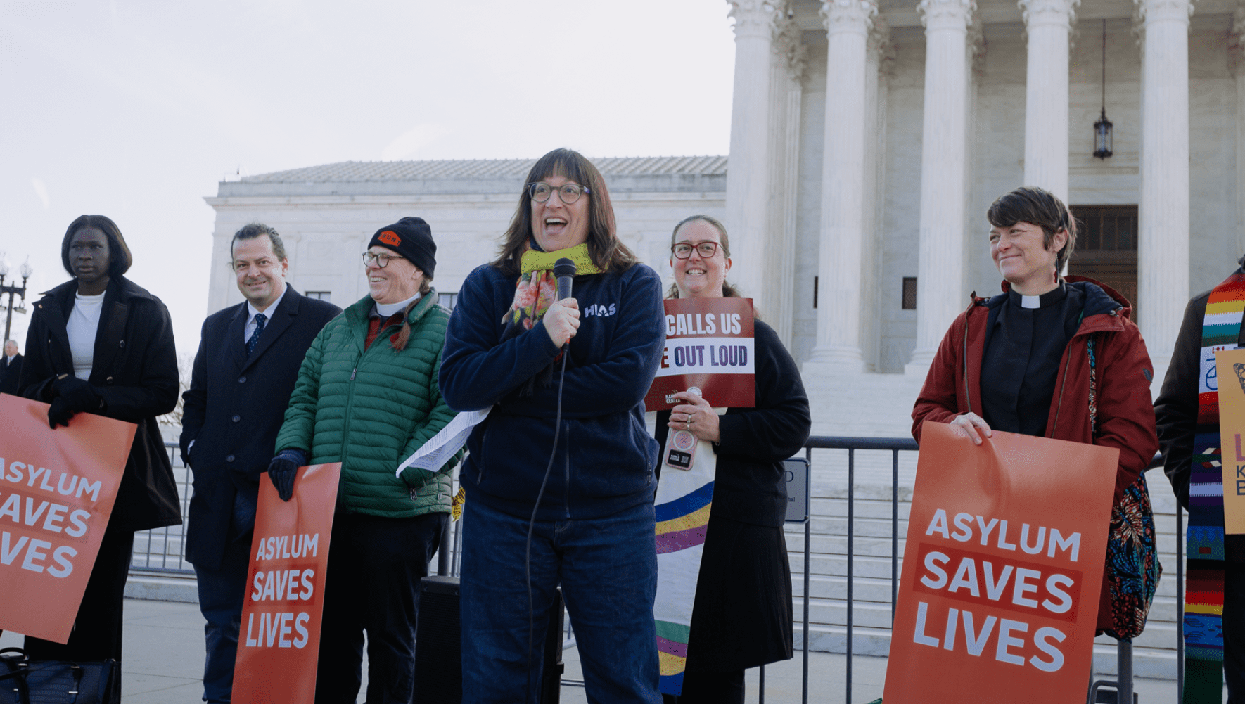 HIAS' VP for U.S. Policy and Advocacy Naomi Steinberg speaks at a rally during the Supreme Court hearing of Mullin v. Al Otro Lado, in which HIAS has filed an amicus brief on March 24, 2026 in Washington, D.C. The Supreme Court will decide whether people fleeing violence and persecution can still seek asylum at the U.S.-Mexico border. (Lindsay Kagalis/HIAS)
