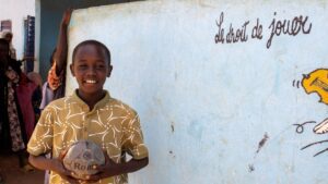 Bachir participates in activities at the Children’s Friendship Center, supported by HIAS with funding from OCHA, in the Farchana refugee camp in eastern Chad in June 2026 (Saam Kouakaine for HIAS)