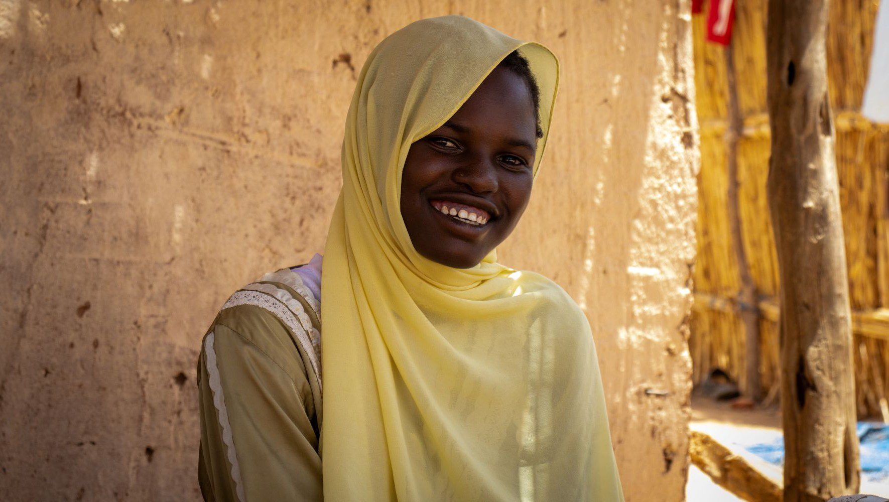 Naima participates in HIAS Chad's weaving and knitting activities, with the support of GFFO, at the Safe Space for Women and Girls in the Aboutengué refugee camp in June 2026 (Saam Kouakaine for HIAS).