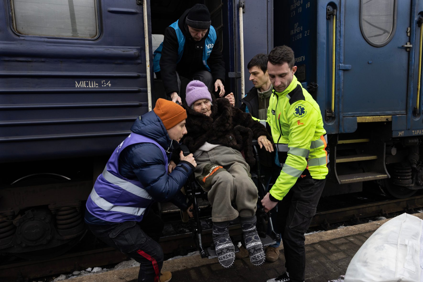 A refugee arrives at the train station in Lviv, Ukraine.