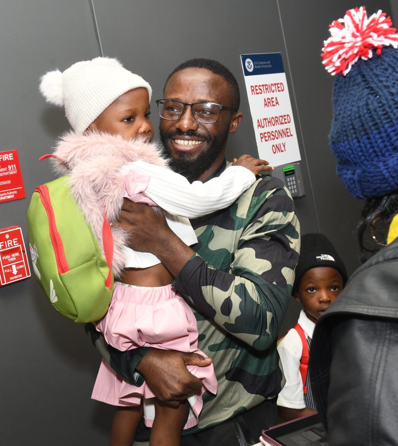 Fon, an asylee from Cameroon, reunites with his family in Washington, D.C. on December 5, 2025. HIAS provided Fon with legal and social services and helped him reunite with his wife and children. (HIAS)