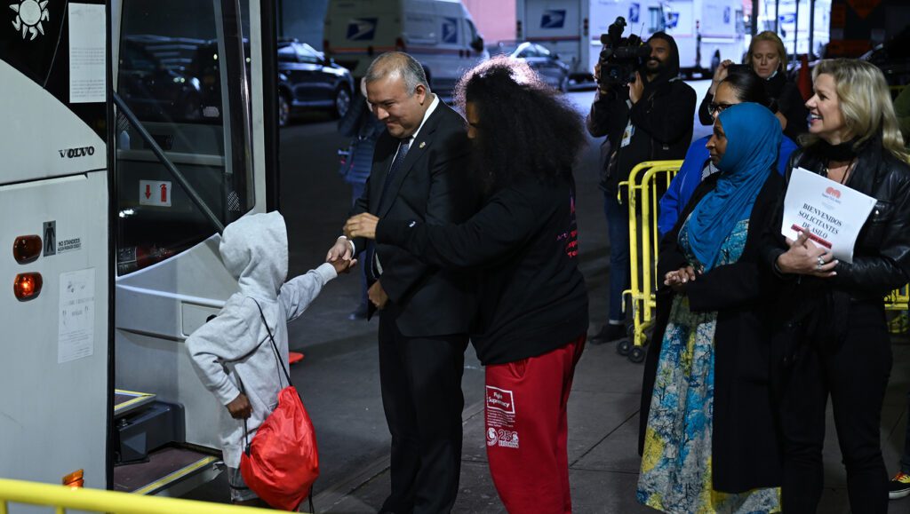 A bus, carrying the migrants from Texas, arrives in Port Authority bus station in New York.