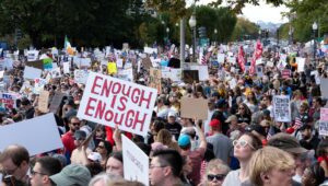 Protesters rally during the "No Kings" national day of protest in Washington, DC, on October 18, 2025. (Roberto Schmidt/AFP via Getty Images)