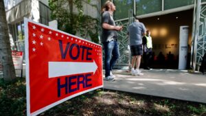 People arrive at a polling location during early voting in the U.S. midterm election, in Atlanta, Georgia, on October 13, 2026. (Erik S. Lesser/Getty Images)