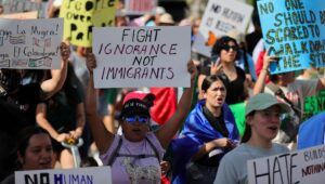 Protesters gather in Houston, Texas, on June 8, 2025, for a demonstration against President Trump's immigration policies and mass deportations. (Reginald Mathalone/NurPhoto via Getty Images)