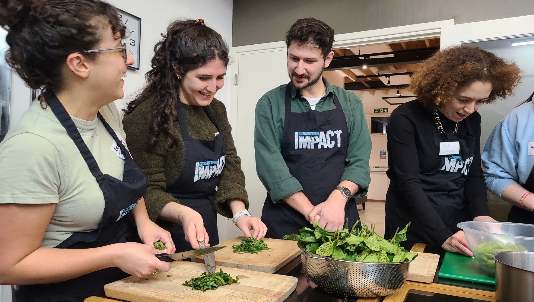 Refugee supporters join HIAS+JCORE and partner OLAM for a cooking event in honor of Refugee Shabbat in London on March 11, 2026. (Jennie van den Boogaard/HIAS)
