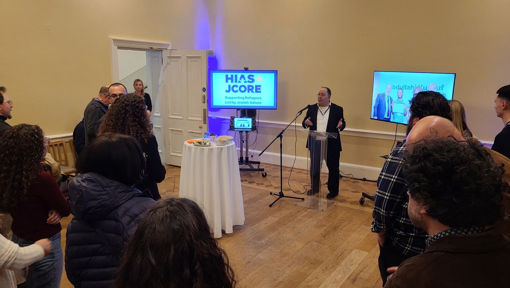 HIAS+JCORE Executive Director David Mason speaks to refugee supporters at the Refugee Shabbat launch event in London on March 12, 2026 (Jennie van den Boogaard/HIAS).