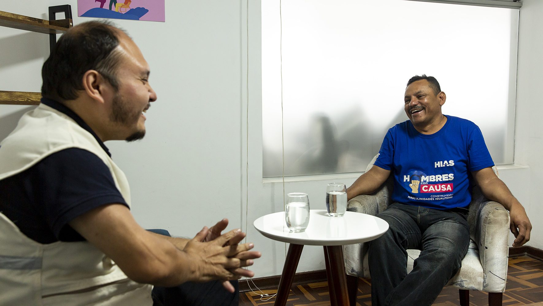HIAS Peru staff member José Mireles Espinoza exchanging ideas with Jesús Fuenmayor (53) about the progress made in his home as a result of the recent course he received on gender and positive masculinities. 
Mireles is a gender and GBV officer of the HIAS Peru staff.