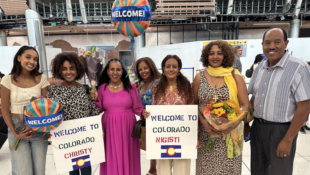 Two Welcome Corps private sponsorship groups, Miracle PSG and Rehoboth Welcomes PSG from Aurora, CO, are reunited with family members from Eritrea at Denver International Airport on September 26, 2024. | How to Help Refugees and Asylum Seekers After the U.S. Elections | HIAS