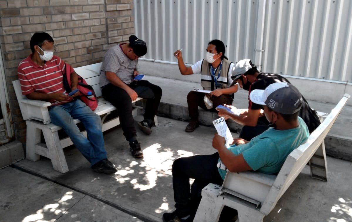 Benigo Diaz (C), a mental health and psychosocial support specialist in HIAS Mexico, leads a group session. September 2021.

(HIAS Mexico)