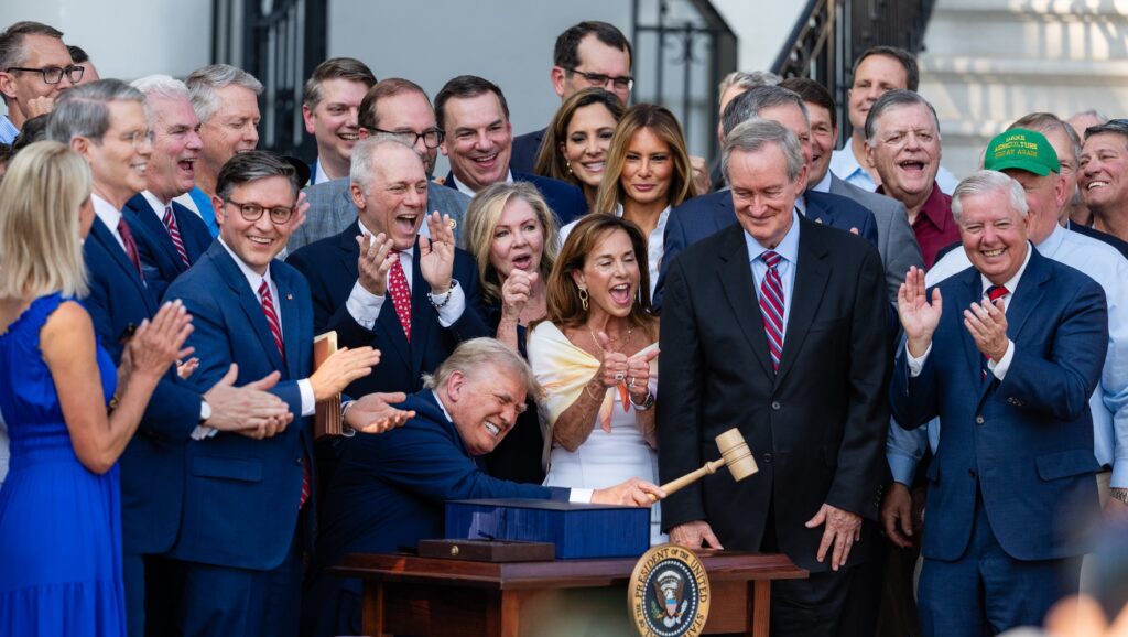 U.S. President Donald Trump, joined by Republican lawmakers, holds a gavel.