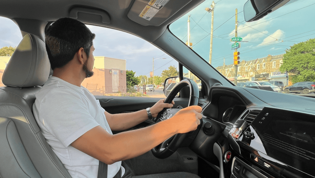 Pedro*, a refugee from Venezuela, shows off the car HIAS helped him purchase so he can get to his job in Philadelphia and support his family. HIAS helps refugees beyond initial resettlement as they rebuild their lives in the U.S.