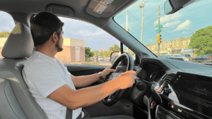 Pedro*, a refugee from Venezuela, shows off the car HIAS helped him purchase so he can get to his job in Philadelphia and support his family. HIAS helps refugees beyond initial resettlement as they rebuild their lives in the U.S.