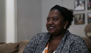 A woman discusses her experience.