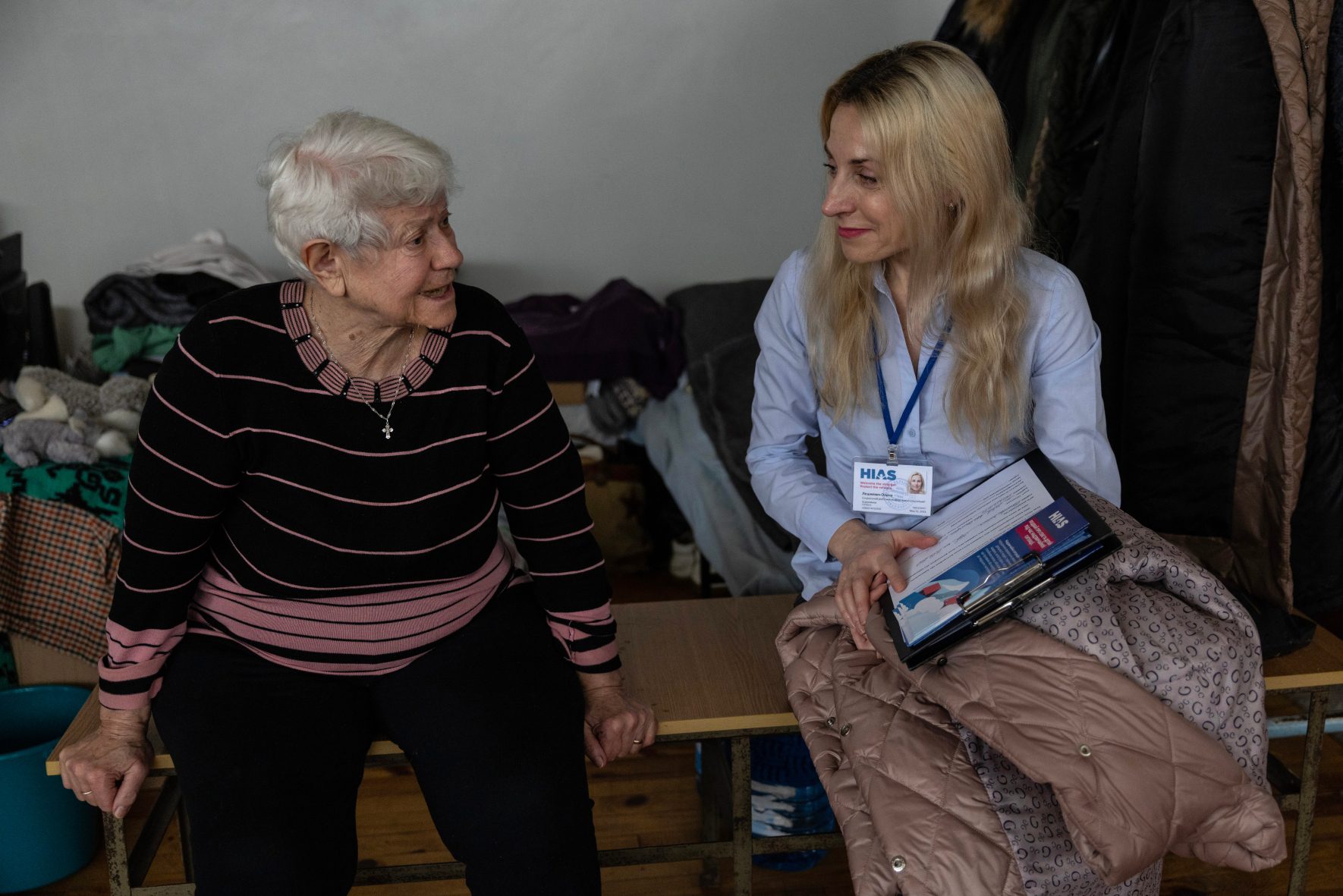 A HIAS worker chats with a resident at a shelter in Lviv, Ukraine.